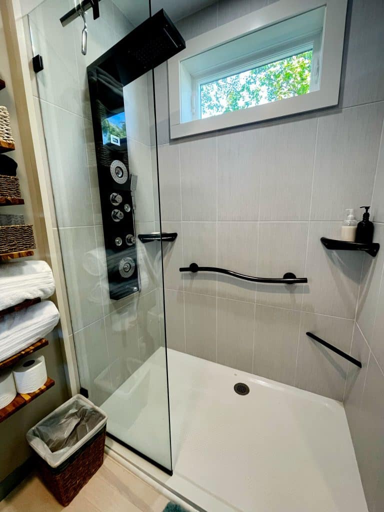 Kim's shower: SENSTEC anti-slip shower tray, hand and foot rails helpful in retirement.